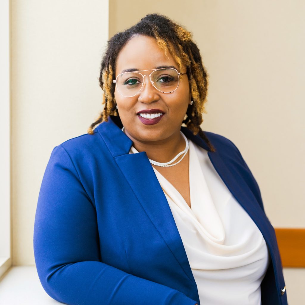 Headshot of Ashley Ashford, Senior Director of Residential Operations wearing a white blouse under a blue blazer.